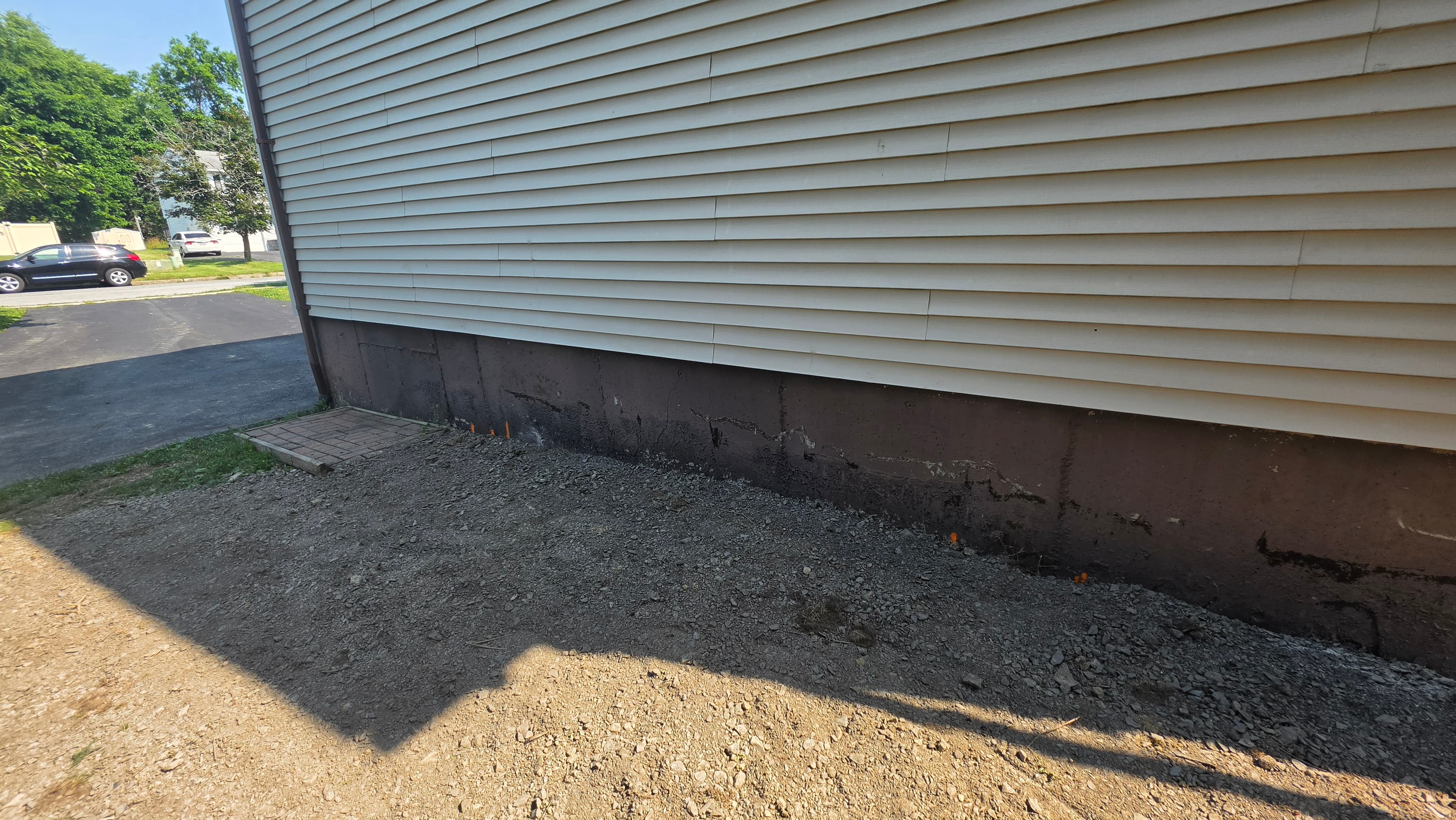 Parged and backfilled garage foundation after repair in Washingtonville, NY
