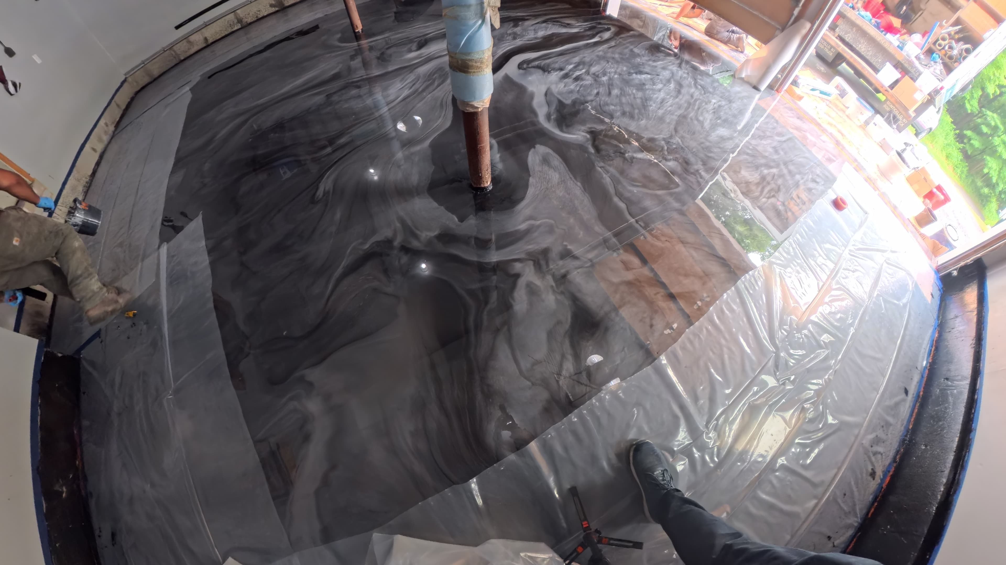 Freshly poured custom swirl epoxy garage floor in Chester, NY